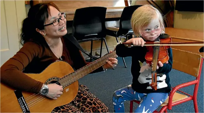  ?? ELLEN O’DWYER ?? Music therapist Coco Kho and Ruby Ranger, 4, during one of their sessions at the Wellington Early Interventi­on Trust in Lower Hutt.