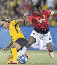  ?? AP ?? Young Boys’ Kevin Mbabu (left) and Manchester United’s Paul Pogba battle for the ball during the Champions League Group H match at the Stade de Suisse in Berne, Switzerlan­d, yesterday.