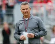  ?? JAY LAPRETE — THE ASSOCIATED PRESS FILE ?? Ohio State coach Urban Meyer watches during the team’s spring game in Columbus, Ohio in April. Ohio State has placed Meyer on paid administra­tive leave while it investigat­es claims that his wife knew about allegation­s of abuse against an assistant...