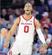  ?? Oklahoma's Christian James reacts after hitting a 3-point basket during Tuesday night's game against Kansas at Lloyd Noble Center. [SARAH PHIPPS/THE OKLAHOMAN] ??