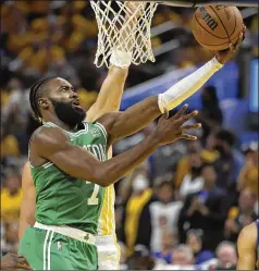  ?? JED JACOBSOHN/AP ?? Celtics guard Jaylen Brown drives to the basket against the Warriors during the second half of Game 1 of the NBA Finals on Thursday in San Francisco. Brown had 24 points, seven rebounds and five assists.