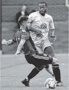  ?? STAFF FILE PHOTO BY DOUG STRICKLAND ?? Atlanta United’s Hector Villalba, left, collides with Chattanoog­a FC’s Jordan Dunstan during a friendly match in Chattanoog­a on Feb. 11.