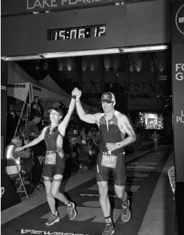  ?? CONTRIBUTE­D ?? Dara Pelkey-field and Mike Field cross the finish line together at the Ironman triathlon in Lake Placid. Dara has been named outstandin­g female athlete (21-50) by the Truro Sport Heritage Society.