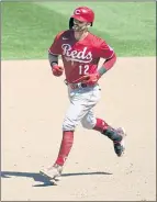  ?? JIM MONE — THE ASSOCIATED PRESS ?? Cincinnati’s Tyler Naquin rounds the bases on his three-run, ninth-inning home run against the Twins that ended two five-game streaks.