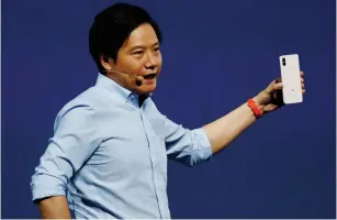  ?? (Bobby Yip/Reuters) ?? XIAOMI FOUNDER Lei Jun introduces the flagship Mi 8 during a product launch in Shenzhen, China.