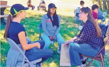  ?? PHOTO COURTESY DENVER ZOO ?? Highlands biology professor Sarah Corey-Rivas, right, talks with Española and Bernalillo high school students at the STEM Showdown last month at the Rio Mora National Wildlife Refuge.