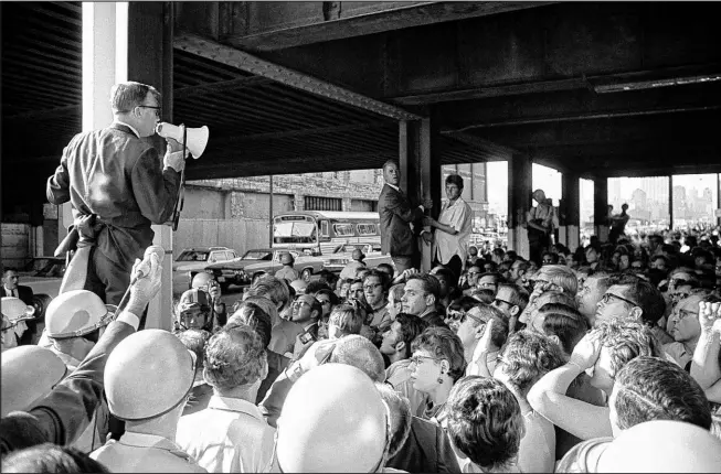  ?? The Associated Press ?? Protesting delegates who tried to march on the Democratic National Convention in Chicago in August 1968. They were stopped by police barricades.