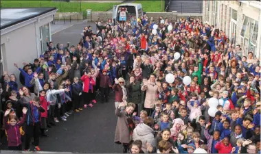  ??  ?? Teachers, pupils and parents turned out to load up the Team Hope van with shoeboxes full of goodies at Scoil Ghobnatan in Mallow last Friday.