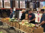  ?? PHOTO COURTESY JOY IN CHILDHOOD FOUNDATION ?? Central NewYork Dunkin’ volunteers celebrated the national “Week of Joy” and supported the Joy in Childhood Foundation’s mission to provide the simple joys of childhood to kids battling hunger by sorting and packing nutritious items into boxes for the Mobile Food Pantry program at the Regional Food Bank of Central New York in Syracuse, NY on Monday, March 18. The Joy in Childhood Foundation also presented Food Bank of Central New York with a $20,000grant to support child hunger relief efforts in Syracuse.