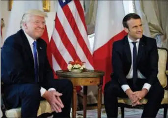  ?? PETER DEJONG, POOL - THE ASSOCIATED PRESS ?? U.S. President Donald Trump meets with French President Emmanuel Macron at the U.S. ambassador’s residence in Brussels, Thursday. The two are among the world leaders in Belgium to attend a NATO summit.