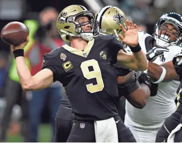  ?? PHOTOS BY JOHN DAVID MERCER/USA TODAY SPORTS ?? Saints quarterbac­k Drew Brees Brees took the Saints on scoring drives of 92, 79 and 67 yards after falling behind 14-0 against the Eagles.