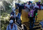  ?? RODRIGO ABD/ ASSOCIATED PRESS ?? Central American migrants traveling with a caravan in hopes of making it to the United States make their way to Pijijiapan, Mexico, on Thursday.