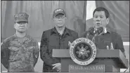  ?? AP/BULLIT MARQUEZ ?? Philippine President Rodrigo Duterte (right) addresses troops Friday during his visit to the 2nd Mechanized Brigade on the outskirts of Iligan city in southern Philippine­s.