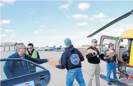  ?? COURTESY/ FULL THROTTLE MAGAZINE NEW YORK ?? At McArthur Airport in Islip, N. Y., a DHL helicopter lands to deliver supplies to Staten Island for victims of the superstorm Sandy.