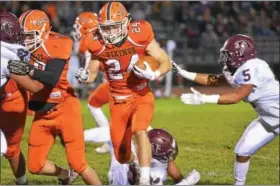  ?? SAM STEWART - DIGITAL FIRST MEDIA ?? Perkiomen Valley’s Brendan Schimpf (24) bursts through the line on a run Friday against Pottsgrove.