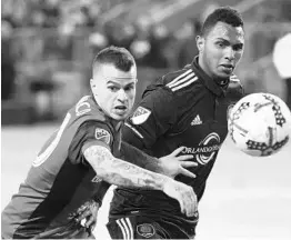  ?? NATHAN DENETTE/ASSOCIATED PRESS ?? Orlando City needs a centerback to replace Tommy Redding (right), long considered a future star for the team, after trading him to the Red Bulls in a deal for Sacha Kljestan.