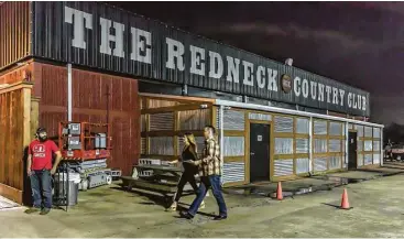  ?? Leslie Plaza Johnson ?? Redneck Country Club members say the food and music venue is a way to meet new friends.