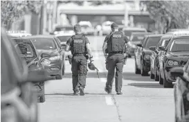  ?? Michael Ciaglo / Houston Chronicle file ?? Police officers leave the scene where Nathan Desai randomly shot and injured six people before he was killed by police in West University Place on Sept. 26. The tactical village would give officers hands-on training for such scenarios.