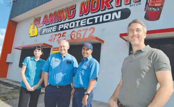  ??  ?? HARD WORK: Flaming North Fire Protection staff ( from left) Annette Halloran, Bob Harding and Wade Quagliata with e- Property agent Steve Whaling.
