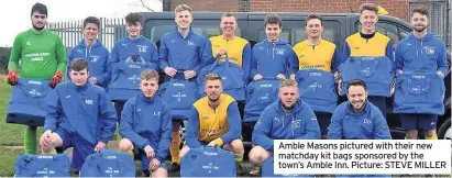  ??  ?? Amble Masons pictured with their new matchday kit bags sponsored by the town’s Amble Inn. Picture: STEVE MILLER