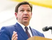  ?? FILE PHOTO BY MATIAS J. OCNER/MIAMI HERALD VIA AP ?? Florida Gov. Ron DeSantis speaks during a news conference at West Miami Middle School in Miami. Florida is among the several states that have scaled back reporting of COVID-19 statistics.