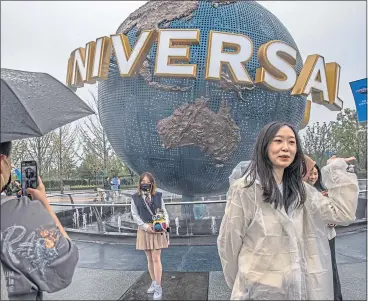 ?? ?? Visitors at the opening of Universal Studios Beijing last week, the latest trade link between China and the US