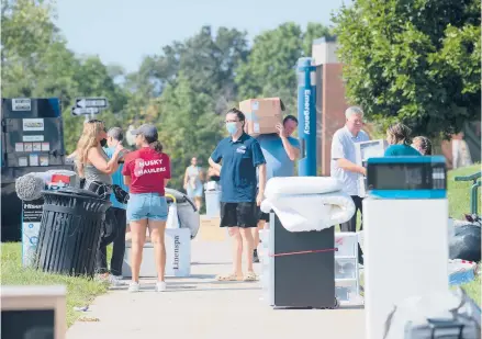  ?? CLOE POISSON PHOTOS/SPECIAL TO THE COURANT ?? About 11,000 students will move into Uconn’s Storrs campus this weekend, filling nearly 90% of the campus’s dorm capacity, double the amount used last year.