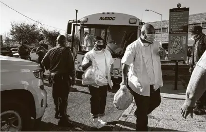  ?? Jonah Markowitz / New York Times ?? Inmates from Northern State Prison are released early in Newark, N.J., on Nov. 4. More than 2,000 inmates were freed to reduce the spread of COVID-19 in the state’s prison system.