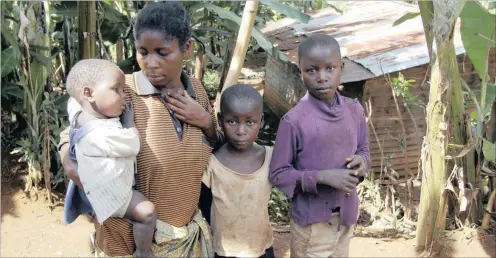  ?? Picture: Lori Waselchuk/Galbe.com ?? ON THEIR BEHALF: Judith, 30, poses with her children, Bernadette, 1, Marlene, 7, and Charma, 11, in a village outside Miti in the Democratic Republic of Congo. She is a victim of sexual violence. These are the very people for whom the FIDH member...