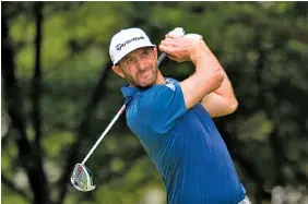  ??  ?? Dustin Johnson tees off on the second hole during Sunday’s final round at the BMW Championsh­ip at Crooked Stick Golf Club in Carmel, Ind. He won the tournament by three shots.