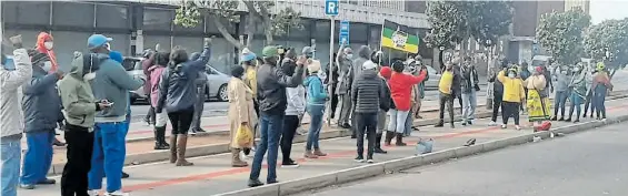  ??  ?? TAKING A STAND: ANC branch members gather outside Florence Matomela House in support of the regional task team yesterday following calls from other members of the party for the RTT to be disbanded