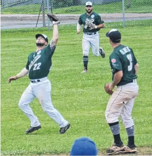  ?? JASON SIMMONDS/JOURNAL PIONEER ?? Charlottet­own Gaudet’s Auto Body Islanders shortstop Kody Matthews makes an inning-ending catch on a pop-up during New Brunswick Senior Baseball League action against the Fredericto­n Royals at Queen Elizabeth Park’s Legends Field in Summerside on Sunday afternoon. Third baseman Dillon Doucette and left-fielder Josh MacDonald provide support to Matthews.