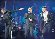  ?? ?? Howard Donald and Gary Barlow of Take That join Callum Scott for the grand finale