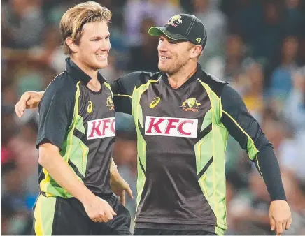  ??  ?? YOU BEWDY: Australia’s Adam Zampa is congratula­ted by captain Aaron Finch during last night’s win over Sri Lanka.