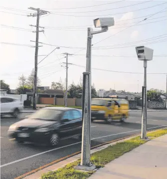  ?? Picture: RICHARD GOSLING ?? The new traffic camera that is costing motorists thousands of dollars at the corner of Rudd St and Bermuda St in Broadbeach Waters.