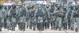  ?? REUTERS ?? ■
Riot police approach a protest site in Hong Kong on Wednesday.