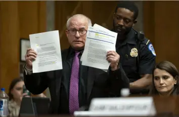  ?? Kevin Wolf/Associated Press ?? Activist Daryl Guberman interrupts a Senate Homeland Security and Government­al Affairs Subcommitt­ee on Investigat­ions hearing to examine Boeing's broken safety culture on Wednesday. Mr. Guberman said he had informatio­n about Boeing to share with the committee.