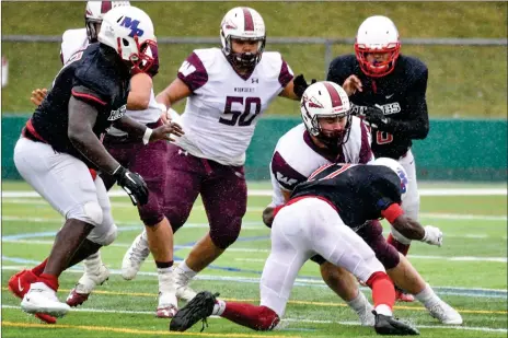  ?? File photo by Jerry Silberman / risportsph­oto.com ?? Woonsocket High graduate Angel Benzant (50) was a dominant force for the 2018 and 2019 Division II Super Bowl champion Novans. After improving his grades at CCRI during the pandemic, Benzant will walk on to the Toledo football team with the goal of earning a scholarshi­p.