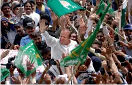  ?? — AP ?? Pakistan’s former Prime Minister Nawaz Sharif waves to supporters, who gathered on a highway to welcome him at Bhara Kahu area, on the outskirts of Islamabad, on Saturday.