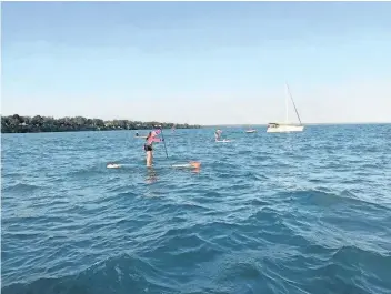  ?? SUPPLIED PHOTO ?? Madeline Leblanc, 20, participat­es in The Lake Ontario Paddle Board Crossing, the first and only open-water paddling race in Canada. Paddlers began the race in Port Dalhousie and finished in Toronto.