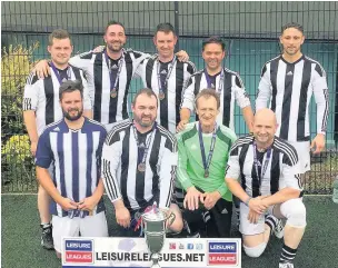  ??  ?? Robert Norfolk, 69, has been playing football since he was 15. Robert is pictured with his winning six-a-side Leisure League team St Brides 76