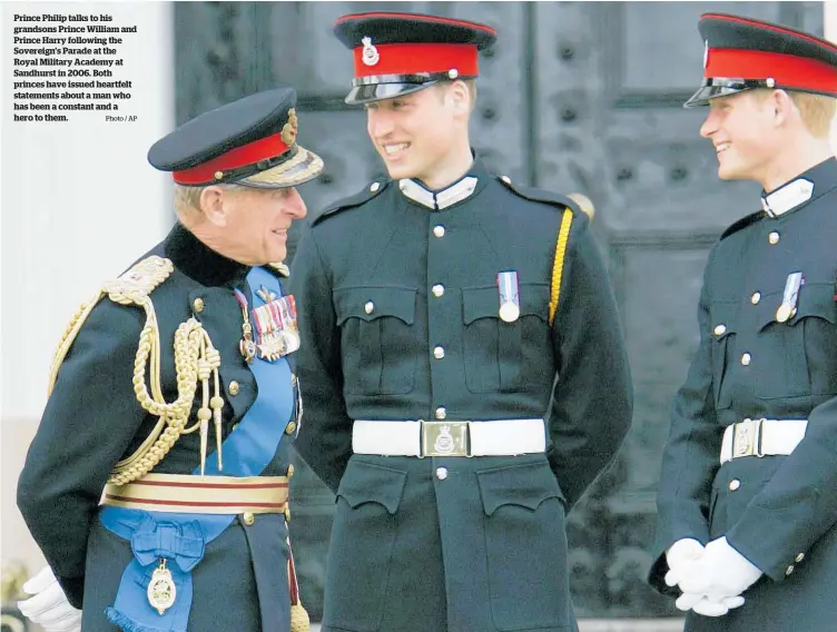  ?? Photo / AP ?? Prince Philip talks to his grandsons Prince William and Prince Harry following the Sovereign’s Parade at the Royal Military Academy at Sandhurst in 2006. Both princes have issued heartfelt statements about a man who has been a constant and a hero to them.