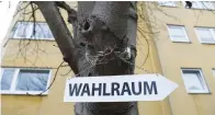  ?? (Kai Pfaffenbac­h/Reuters) ?? A SIGN READING ‘polling station’ is seen on a tree during the Hesse state election in Giessen, Germany.