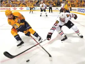  ??  ?? Blackhawks defenseman Johnny Oduya, battling Calle Jarnkrok for the puck, struggled all series against the high- flying Predators.
| FREDERICK BREEDON/ GETTY IMAGES