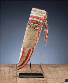  ??  ?? 1. Oto ball club. Estimate: $35/45,000 2. Cheyenne River Sioux pictorial beaded hide tobacco bag. Estimate: $30/50,000 3. Early Eastern Plains quilled hide knife sheath. Estimate: $20/25,000 4. Arikara beaded hide dress. Estimate: $20/25,000