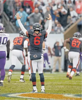  ?? | AP ?? Jay Cutler gives the touchdown signal after his scoring pass to Brandon Marshall in the first quarter Sunday.