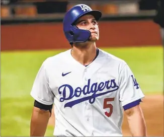  ?? COREY SEAGER Robert Gauthier Los Angeles Times ?? became an All-Star shortstop and helped the Dodgers win a World Series; now he’s cashing in: $325 million to go to Texas, where he pounded the ball during the 2020 postseason.