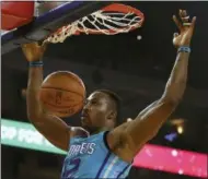  ?? BEN MARGOT — THE ASSOCIATED PRESS FILE ?? In this file photo, Charlotte Hornets’ Dwight Howard scores against the Golden State Warriors during the first half of an NBA basketball game, in Oakland.