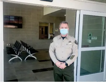  ?? Alex Maclean / Union Democrat (above); courtesy photos /Tuolumne County Sheriff’s Office (all others) ?? Tuolumne County Sheriff Bill Pooley stands at the entrance to the Sheriff J.H. “Jack” Dambacher Detention Center in Sonora, which now housestuol­umne County’s jail inmates.the new jail can house 230 inmates.