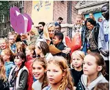  ??  ?? Minister Sigrid Kaag hugs a child after receiving a petition from ‘War Child’, an NGO which works exclusivel­y to improve the resilience and wellbeing of children living with violence and armed conflict